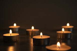 bigstock-Seven-Small-Lighted-Candles-In-